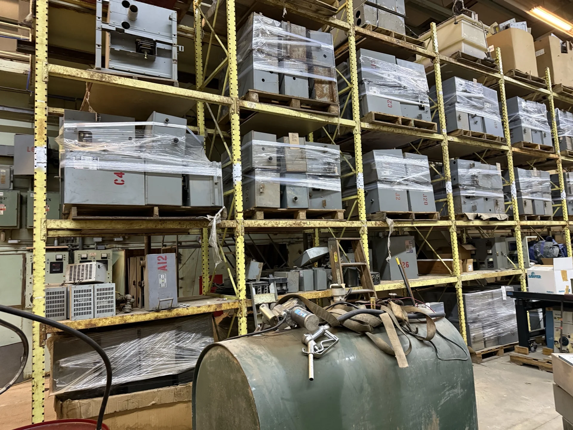 Rows of bus plugs stored on industrial warehouse racks
